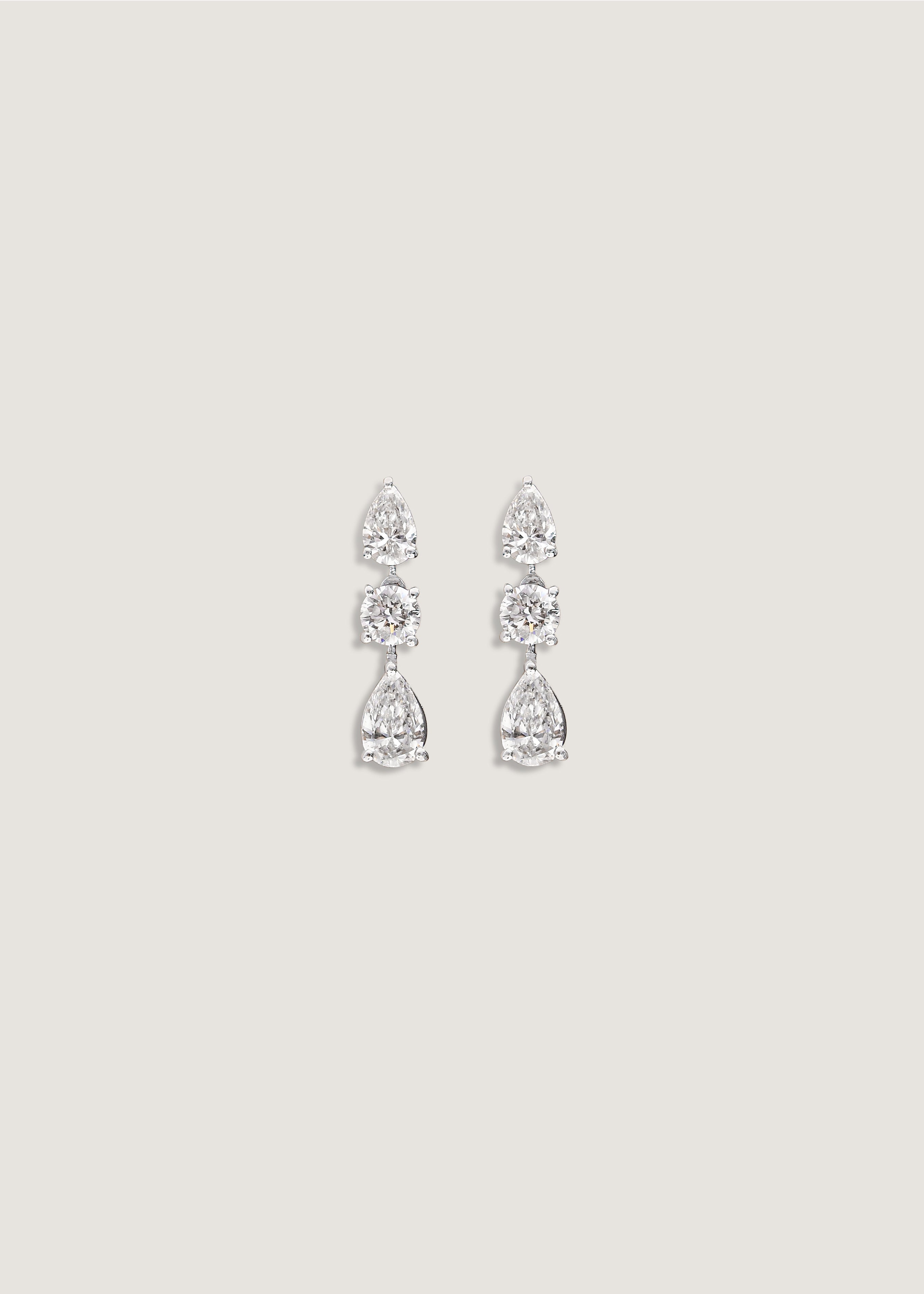 A pair of Kinn 14k White Gold Third Time's a Charm Drop Earrings Pear 2.7ctw Diamond
