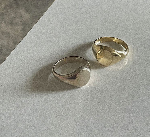 alt="Pair of custom white gold and yellow gold Classic Signet Rings"