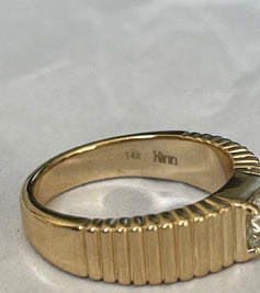 alt="14k stop and Kinn engraving inside the Solis Ribbed Ring II"