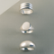 3 Kinn Studio 925 sterling silver rings laid on a silver background