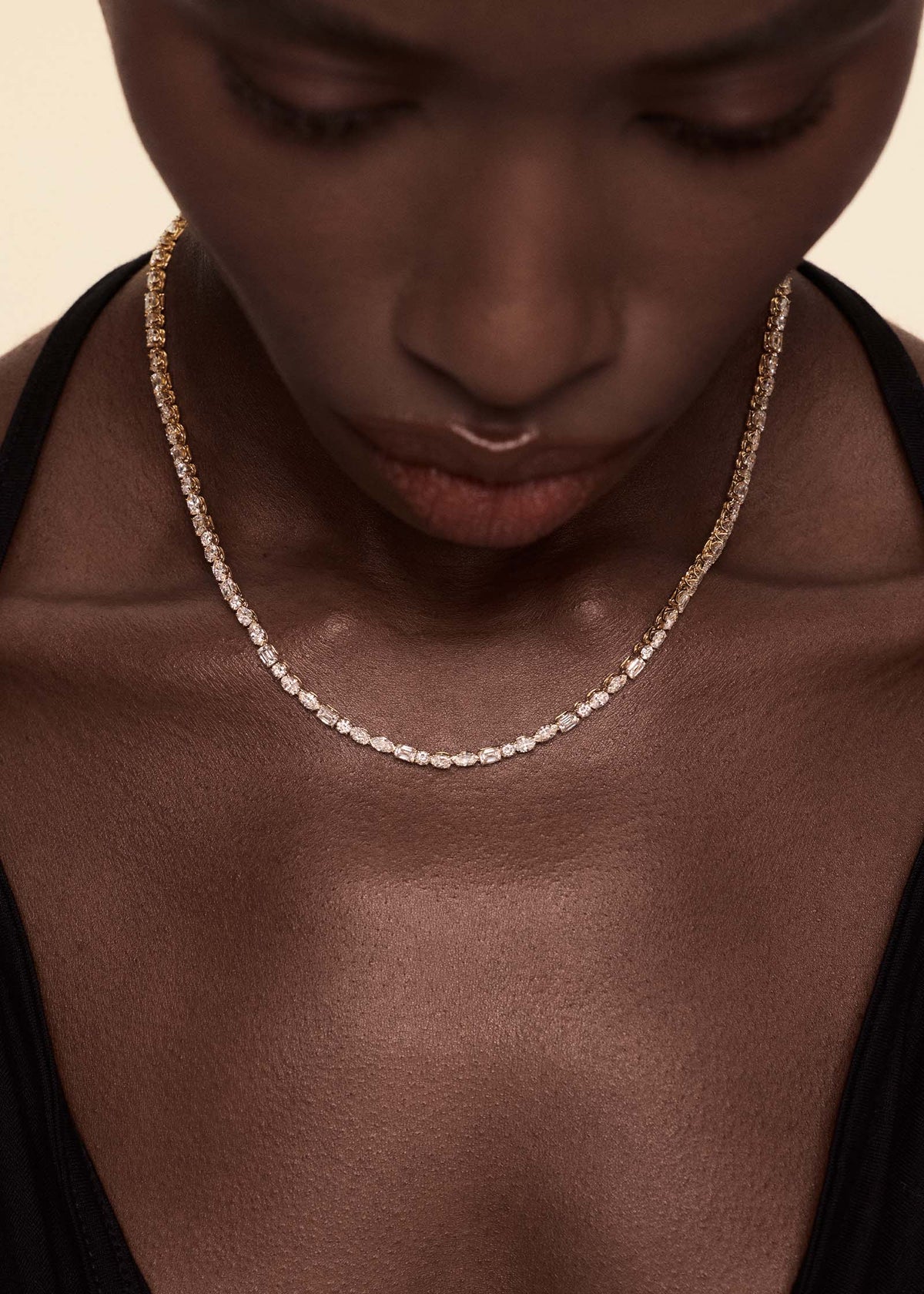 Model wearing a Kinn 14k Yellow Gold Esme Fancy Shape Diamond Tennis Necklace