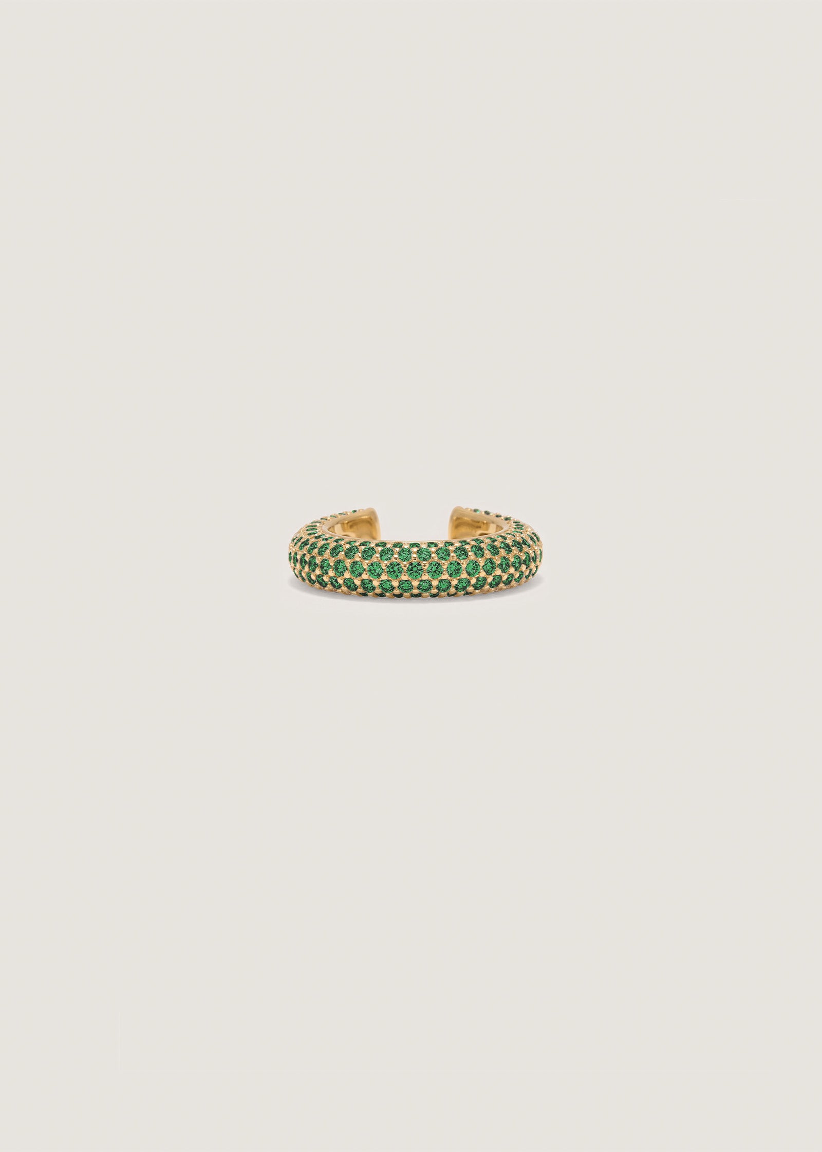 Front direct view of a Kinn x Prince 14k Gold Love Pavé Emerald Earring Cuff