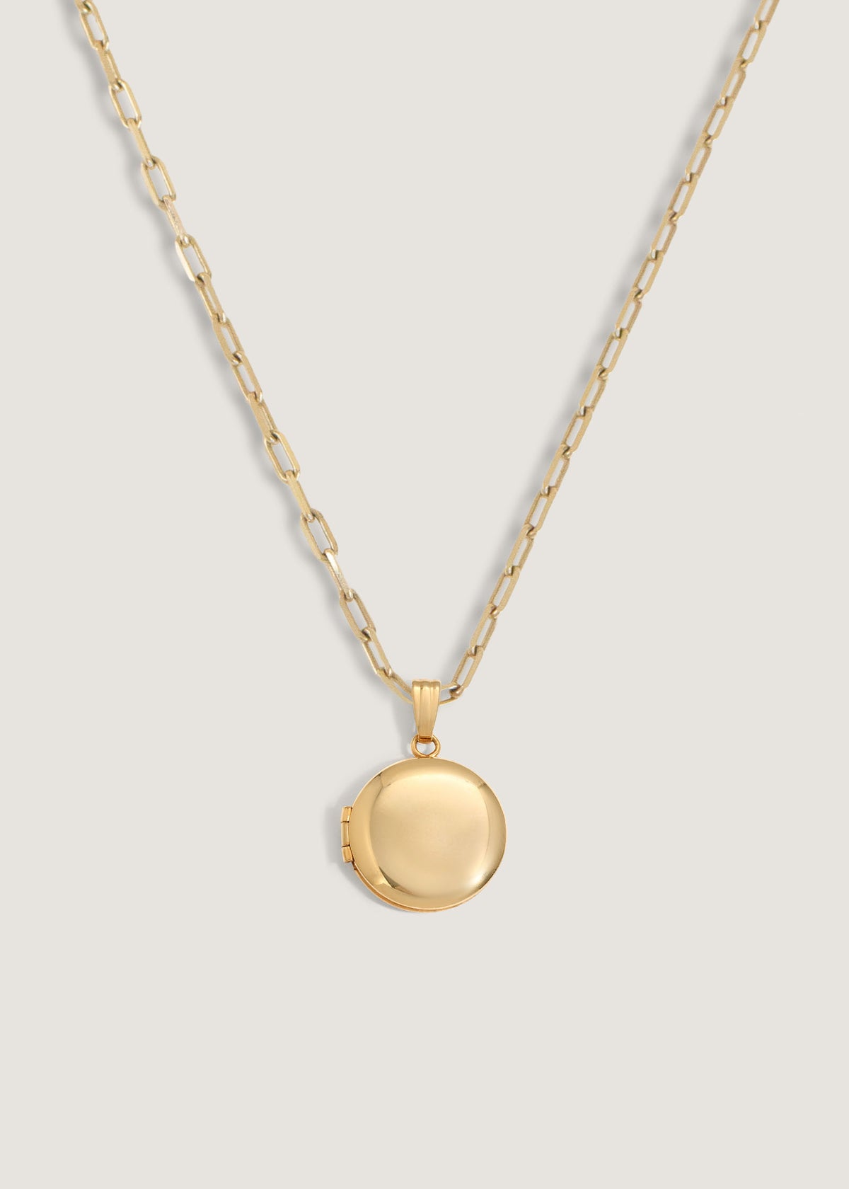 A Kinn 14k Gold Maison Round Locket on a Micro Link Chain Necklace