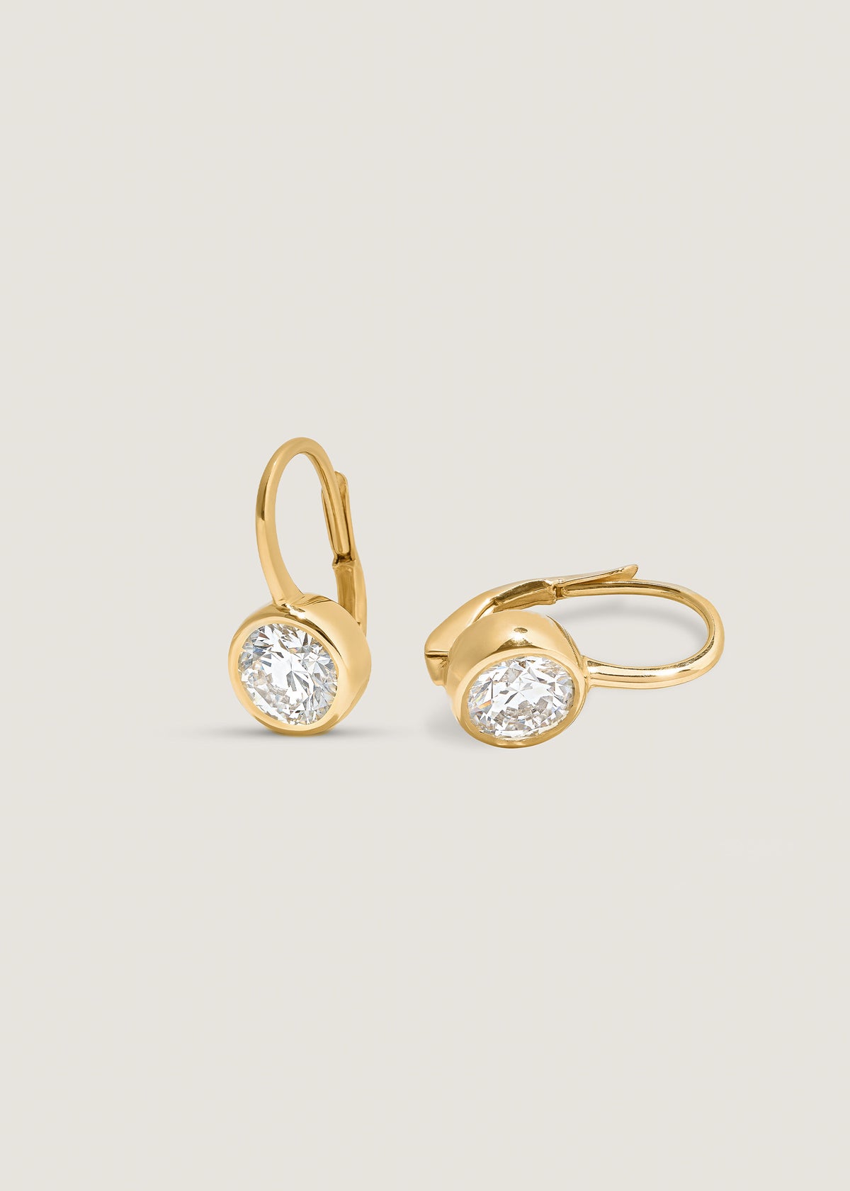 Angled view of a Kinn 14k Yellow Gold Harper 2ctw Round Drop Earrings