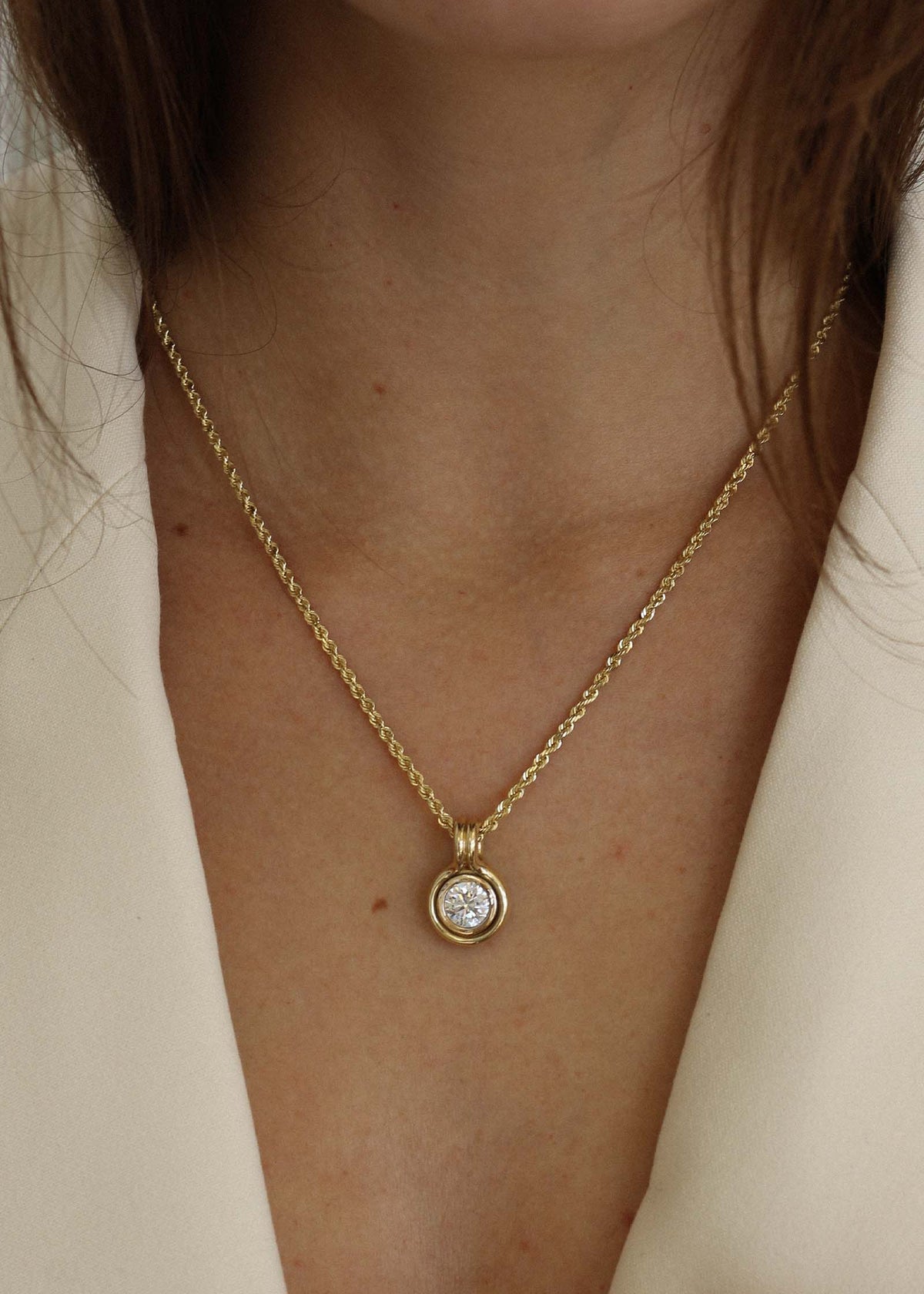 woman wearing a Kinn Studio 14k Gold Jody Round Diamond Pendant on a Rope Chain Necklace