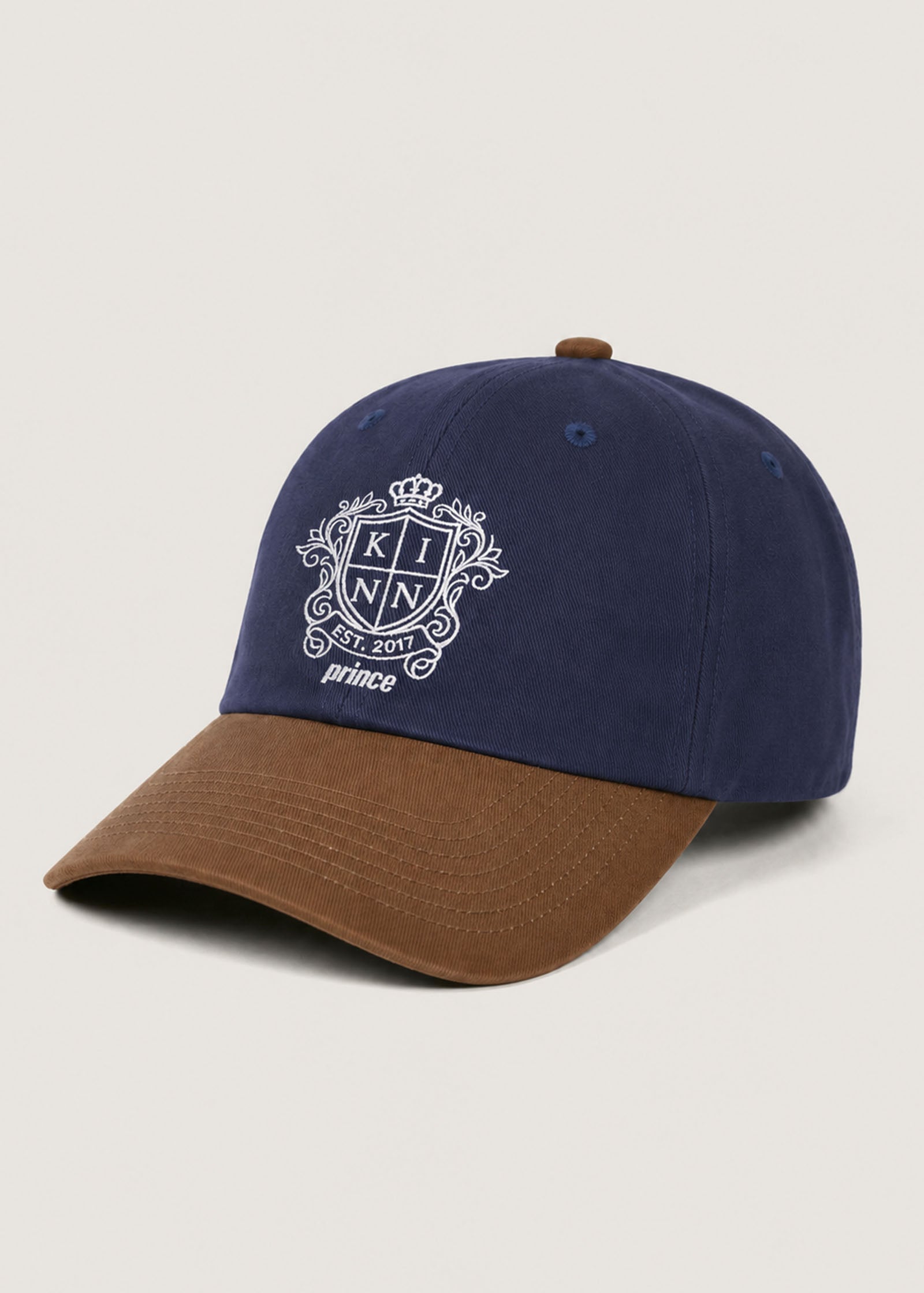 Front angled view of a Kinn x Prince The Court Cap