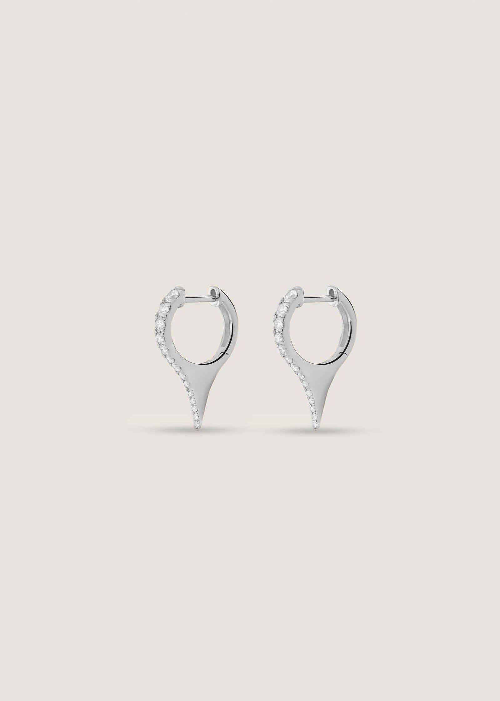 Side profile view of Kinn x Prince 14k White Gold Point Pavé Diamond Huggie Earrings