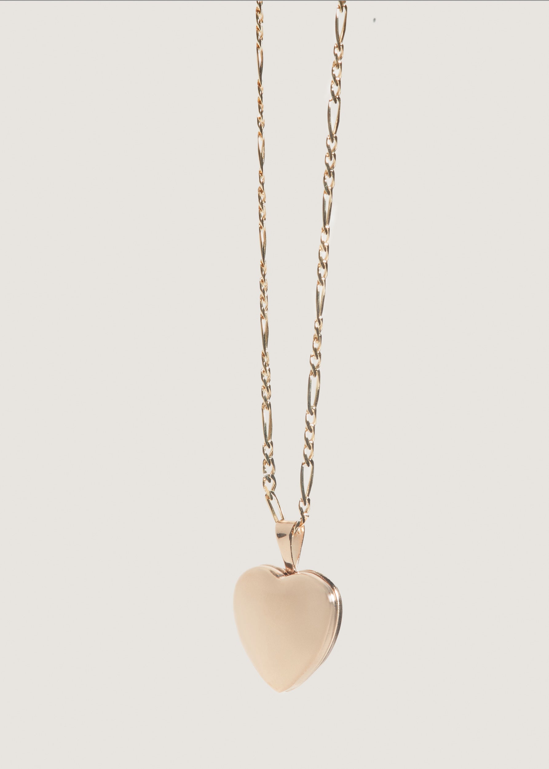 alt="Maison Heart Locket I with kyle figaro chain"