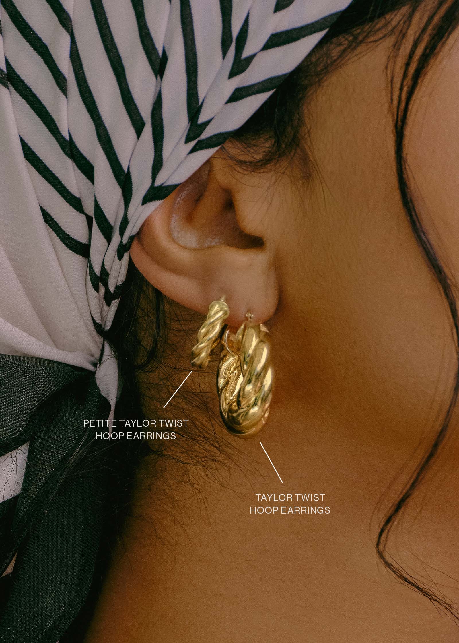 close up of a woman in a striped bandana wearing a Kinn 14k Gold Taylor Twist Petite Hoop Earring in her second piercing layered with a Taylor Twist Hoop