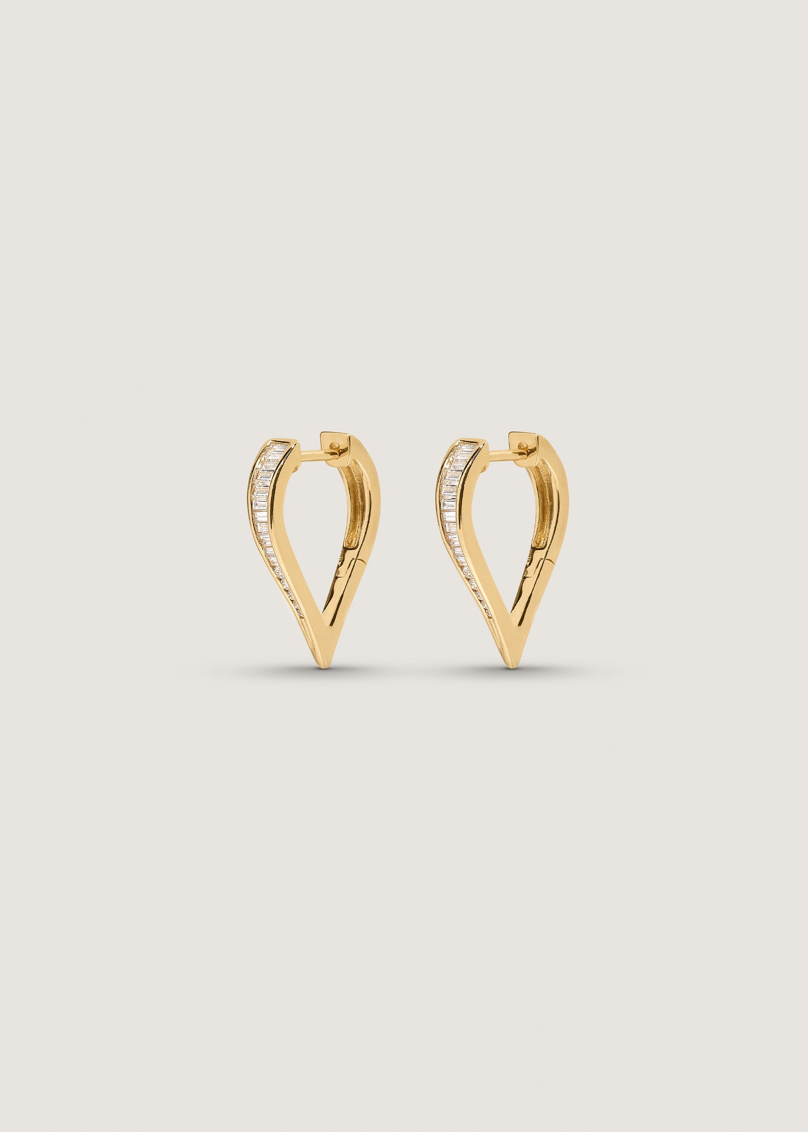 angled side view of a pair of 14k Gold Viola Baguette Diamond Drop Earrings 