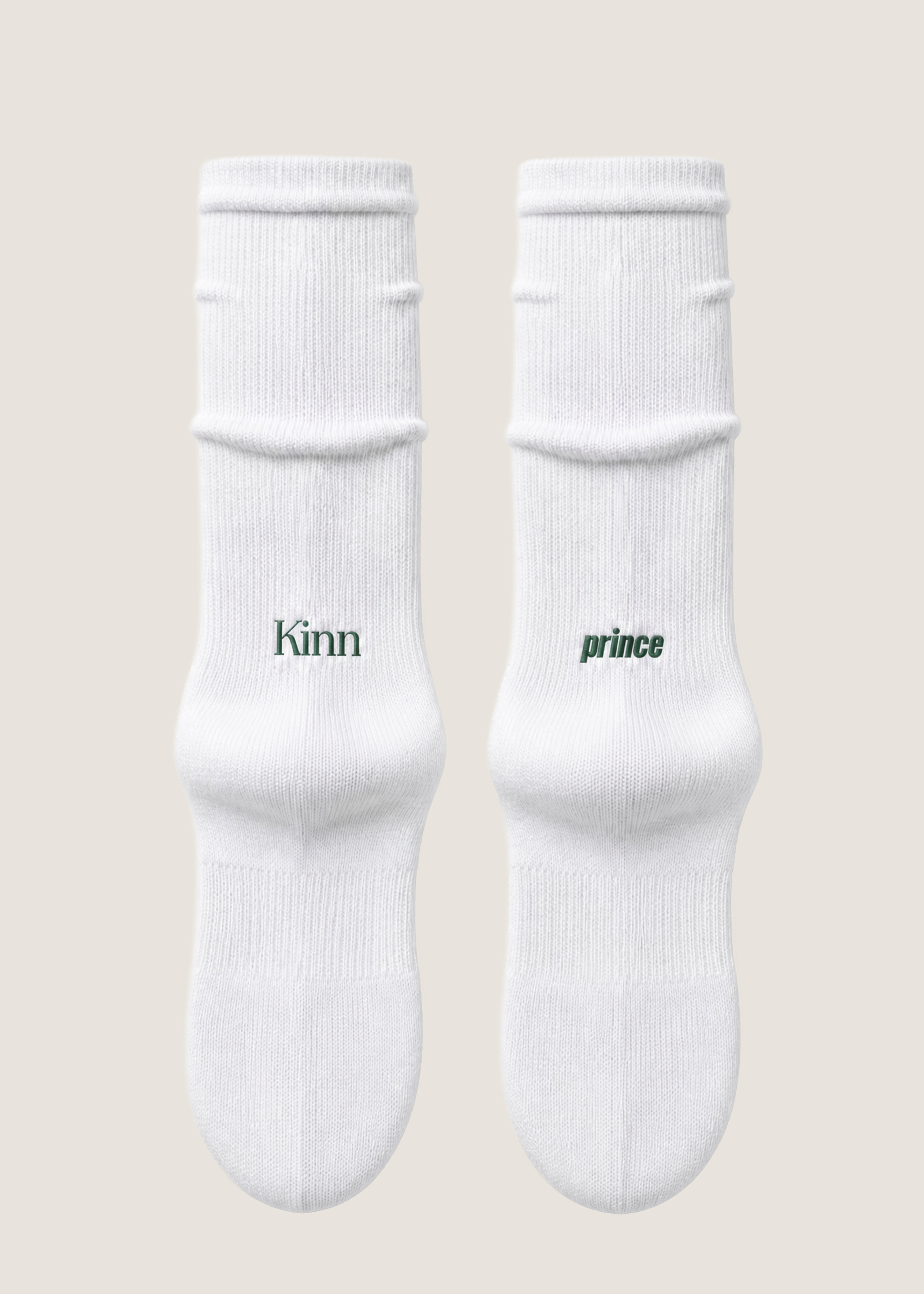 A pair of Kinn x Prince Crew Socks laying flat