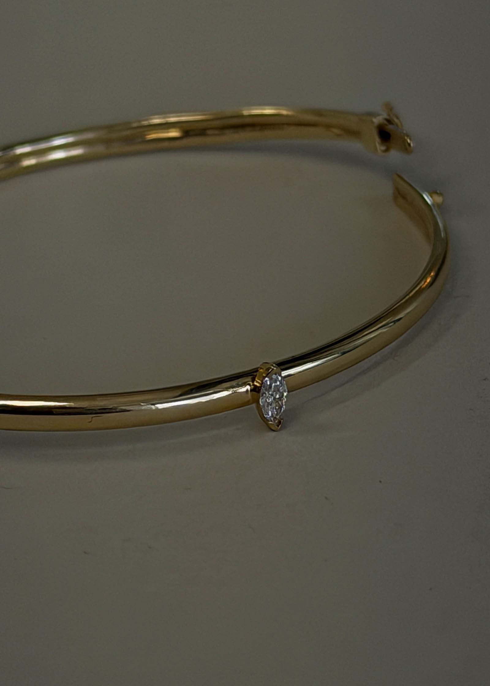 close up of the diamond on the Kinn Vintage 14k Gold Bangle with Marquise Diamond