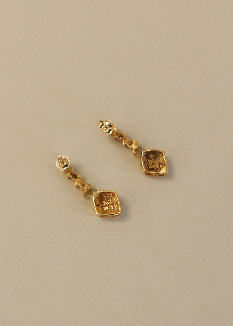 Kinn Vintage 14k Gold Kite Diamond Dangle Earrings laid flat front side down