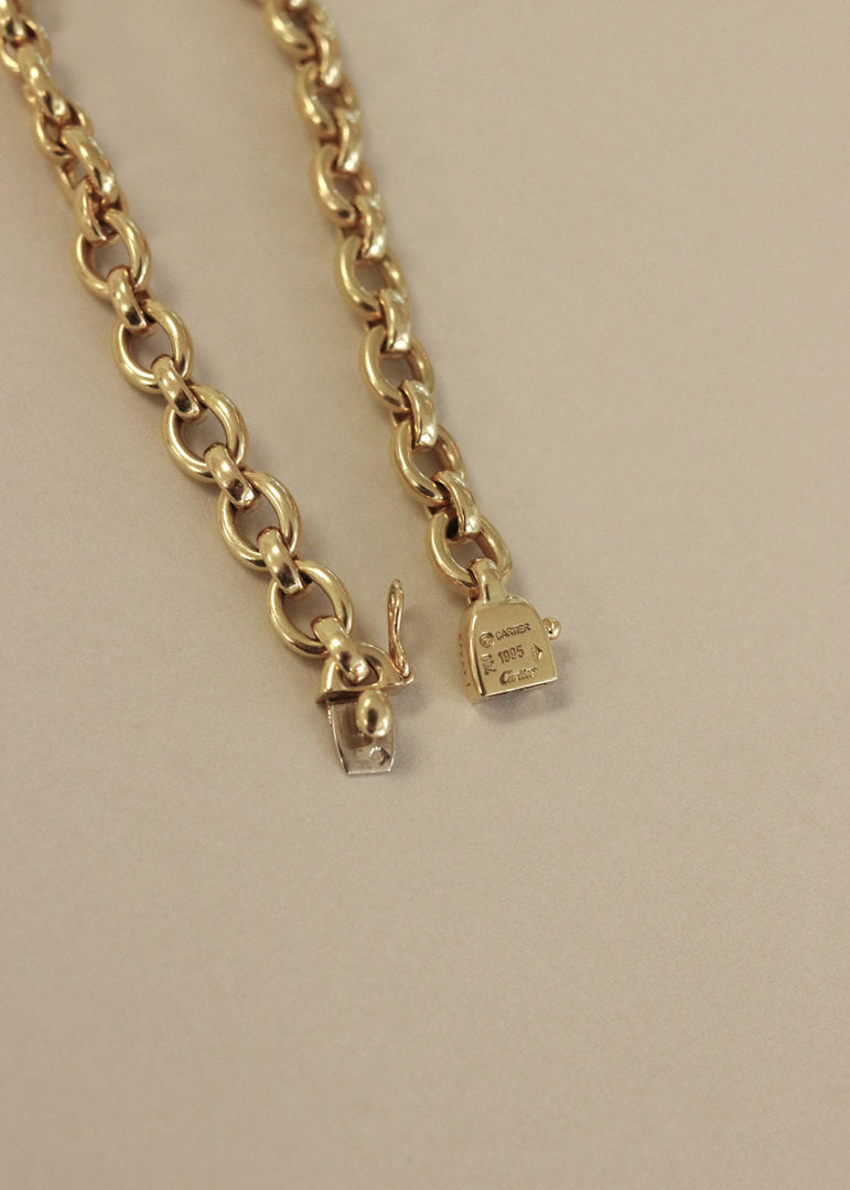 clasp of the Kinn Vintage 18k Gold Cartier Charm Bracelet