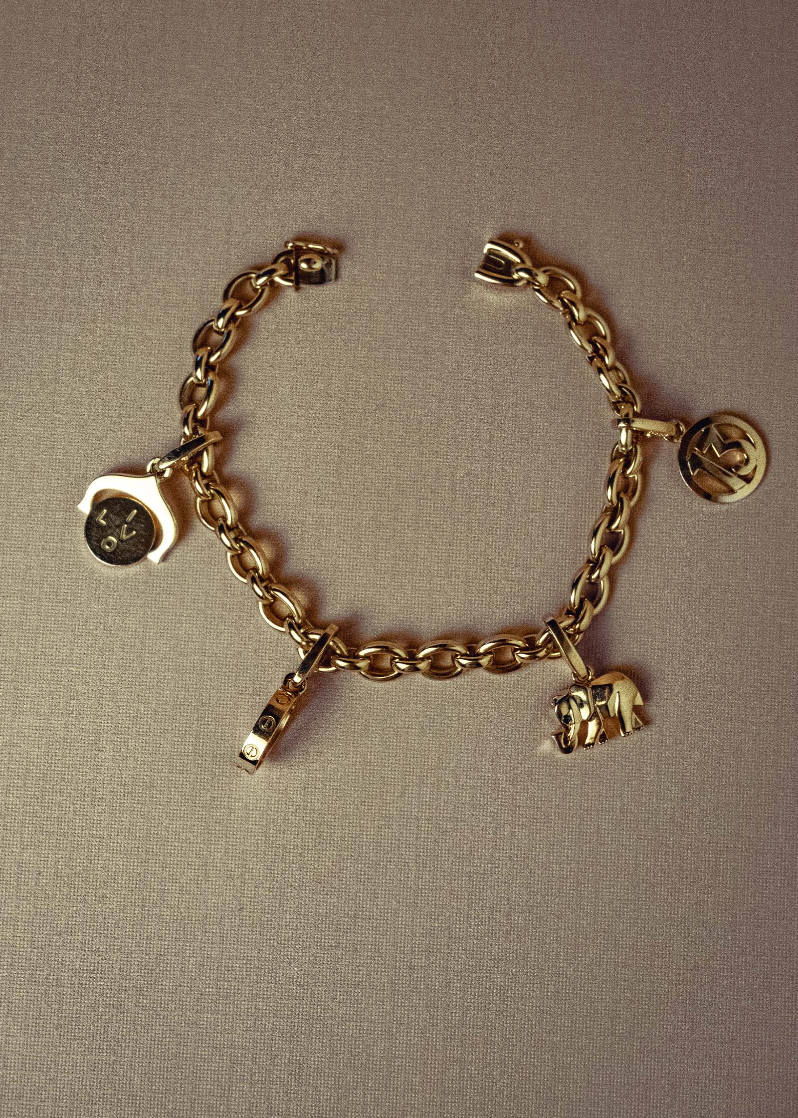 Kinn Vintage 18k Gold Cartier Charm Bracelet laid flat in a circle