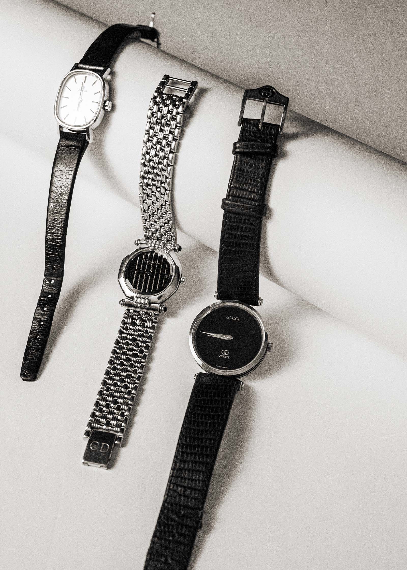 Black and white image of 3 vintage watches