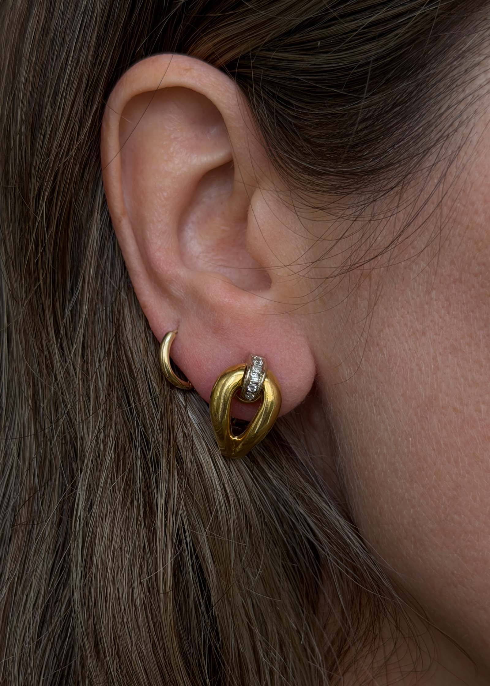 close up of woman wearing Kinn Vintage 18k Gold Tubular Teardrop Pavé Earrings