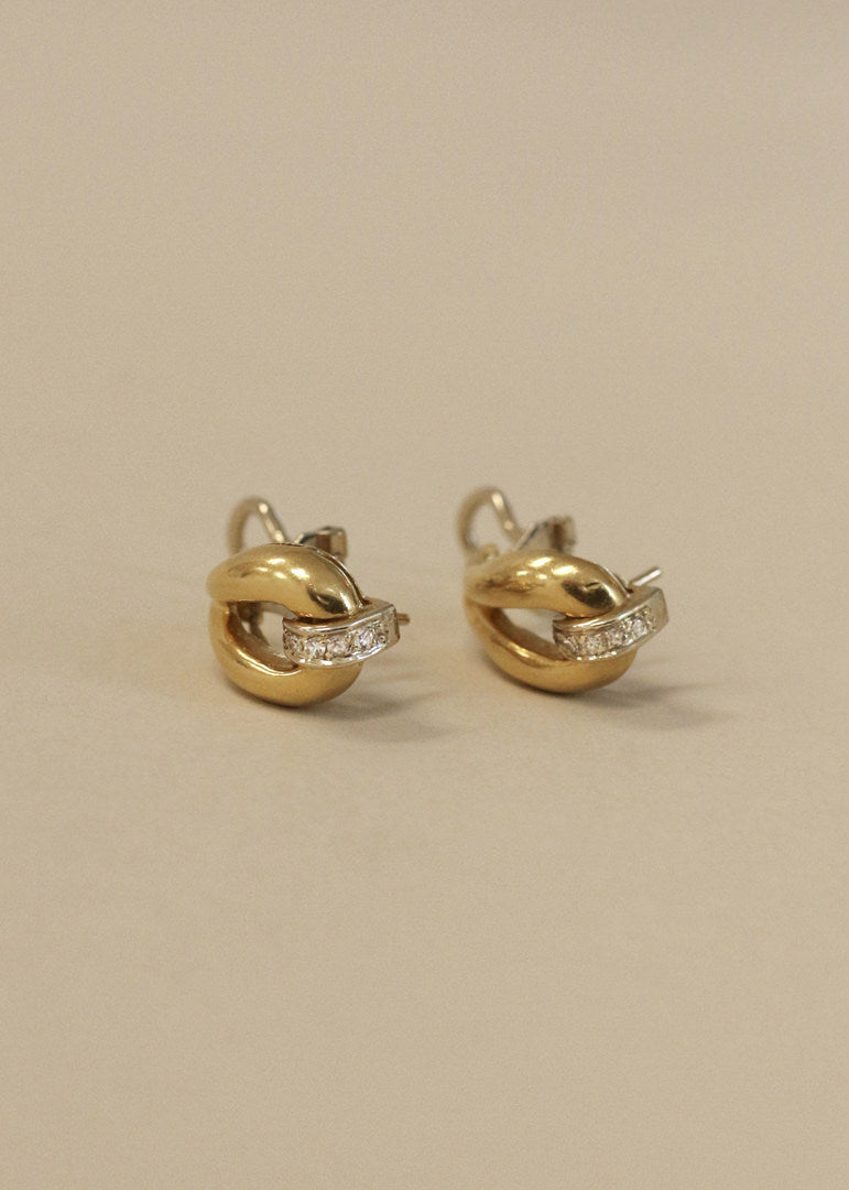 Kinn Vintage 18k Gold Tubular Teardrop Pavé Earrings laid flat on their sides