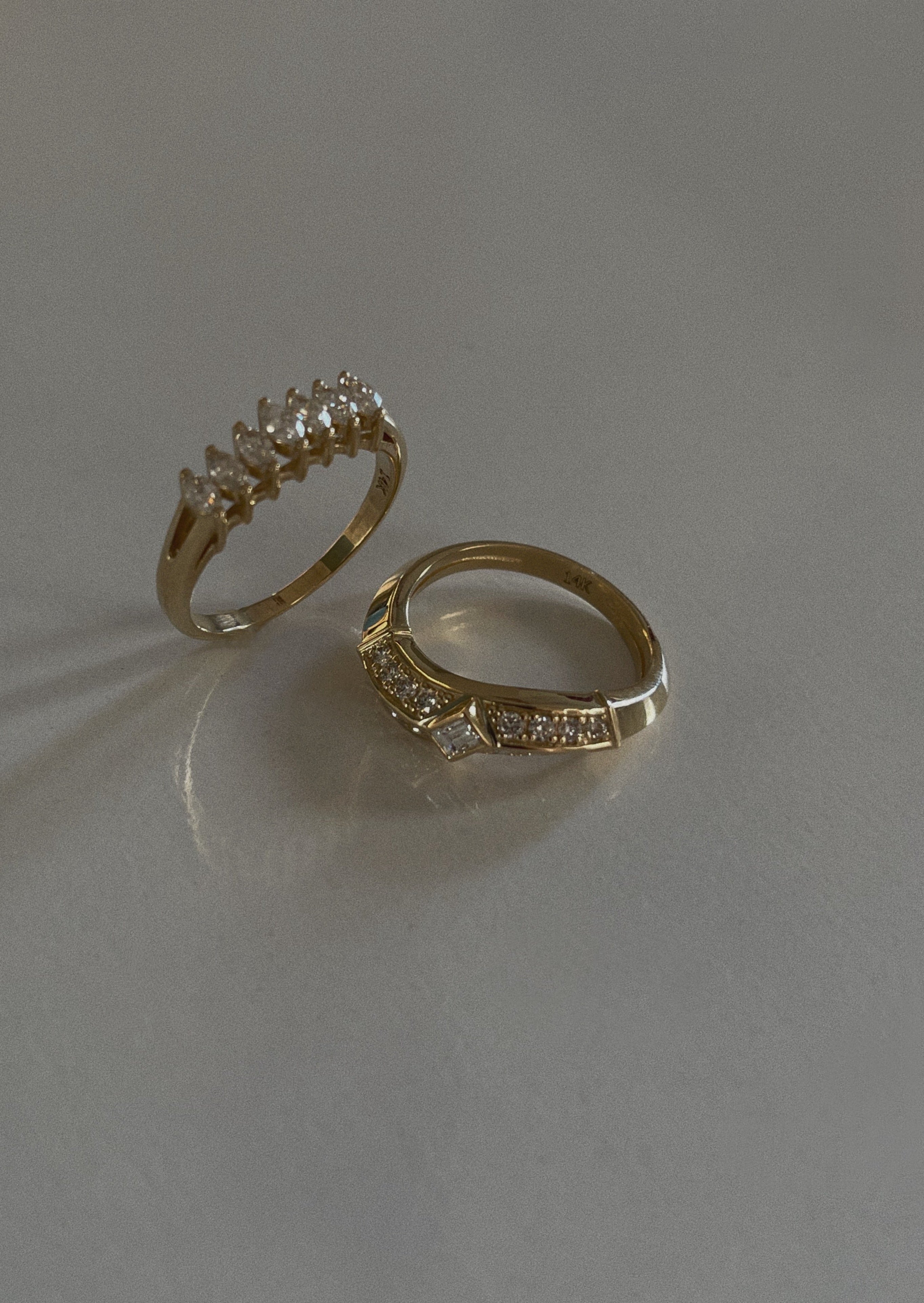 alt="Seven Marquise Ring with franco curved ring"