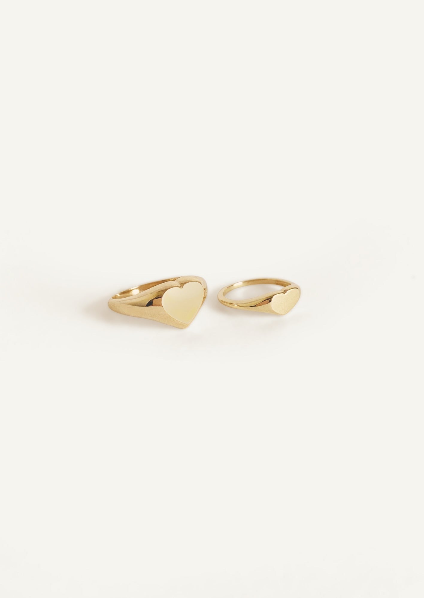 alt="Classic Heart Signet Ring compared to a petite heart signet ring"