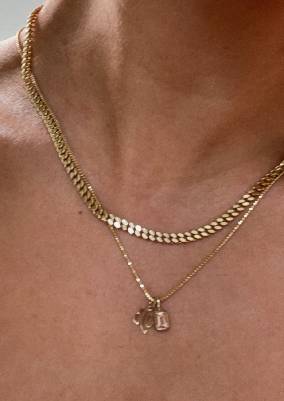 alt="Capri Curb Chain Necklace II styled with box chain and pendants"