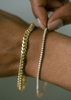 alt="Diana Diamond Tennis Bracelet styled with the familia cuban bracelet" 