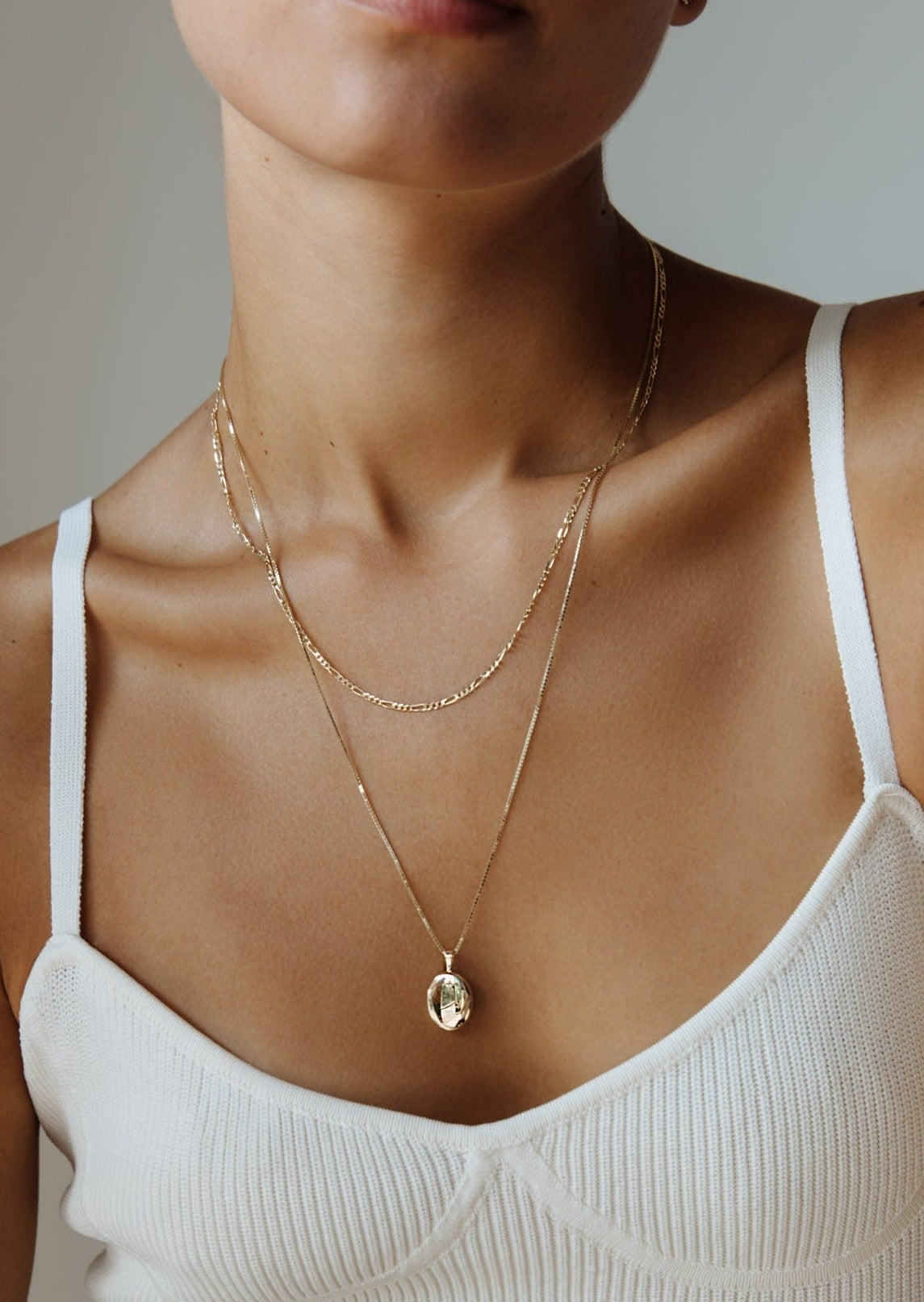 alt="Kyle Figaro Chain Necklace with maison oval locket"