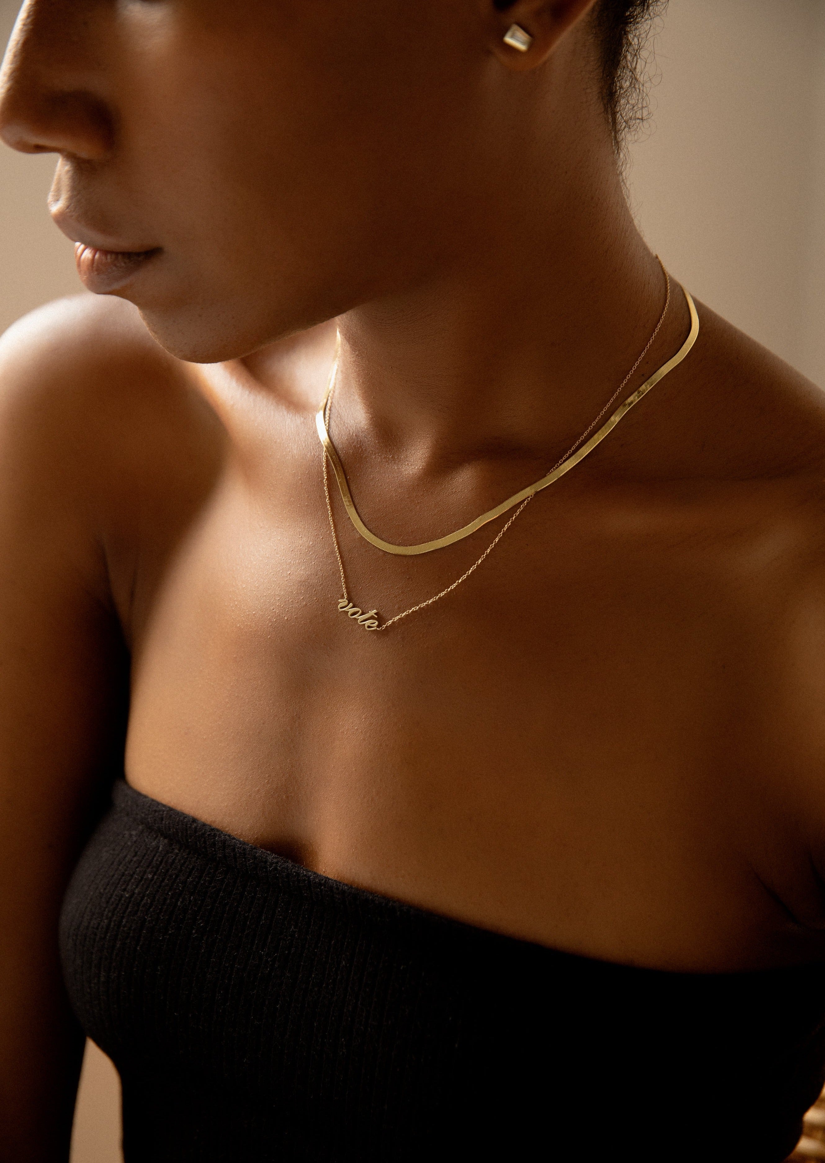 alt="Vote Necklace II with a carter herringbone chain necklace II"