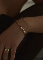 alt="Classic Cigar Band Ring styled with the Theo Elongated Chain Bracelet and Petite Link Chain Bracelet"