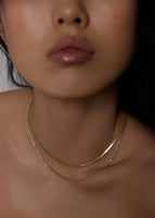 alt="Rope Chain Necklace styled with the Carter Flat Herringbone Chain II"
