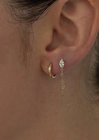 alt="Petite Hoop Huggie Earrings with marquise chain earring"