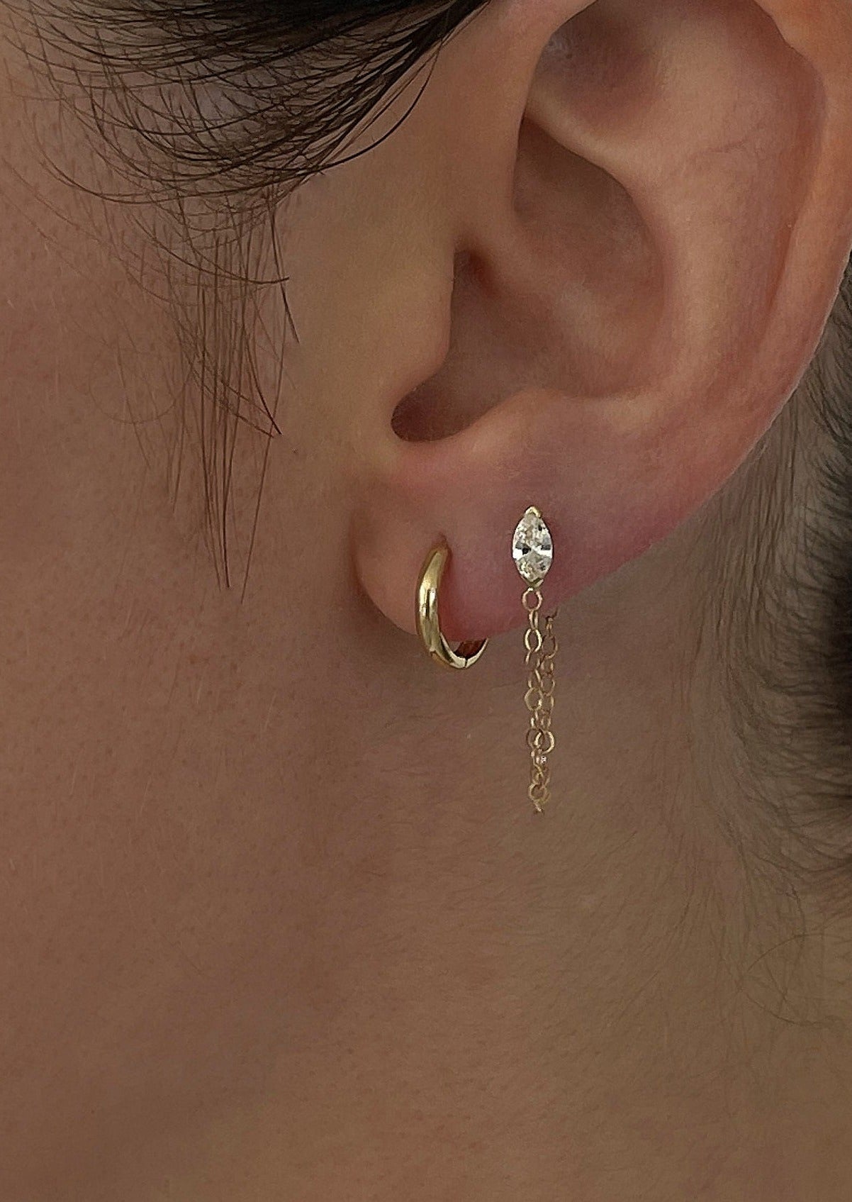 alt="Petite Hoop Huggie Earrings with marquise chain earring"