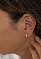alt="Petite Bar Stud & Petite Huggie Earring Stack"