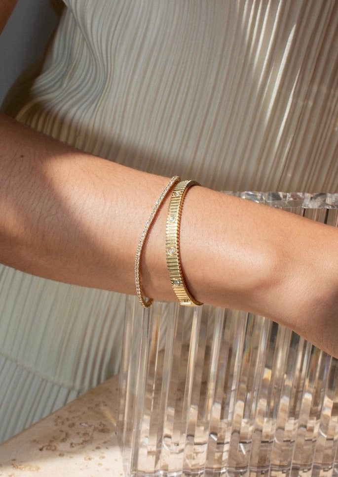 alt="Diana Diamond Tennis Bracelet styled with the Solis ribbed IV anniversary bracelet"