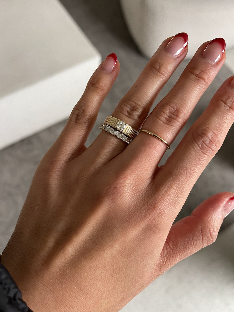 alt="Barely There Stacking Ring II styled with the Solis Ribbed Ring II and Marquise Eternity Ring"